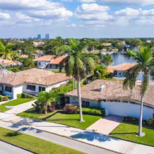 An image of a vibrant Hollywood, FL neighborhood, showcasing luxurious waterfront properties and stunning palm-lined streets